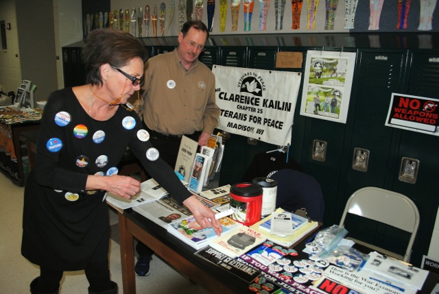 Veterans for Peace Chapter 25 was well represented by member Steve Books with an informational table at the 8th Annual Wisconsin Progressive Grassroots Festival on Saturday, April 2, 2016, at Wisconsin Heights High School, Mazomanie. Attended by a large crowd, the day-long festival topic was “Organizing for Change.” The woman pictured was among numerous visitors who examined information provided by Steve. She chose to buy a copy of Smedley Butler’s excellent book: “War Is a  Racket.”